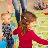 young children dancing inside doing indoor activities during winter