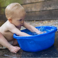 baby playing with water showing different water play ideas young kids can do