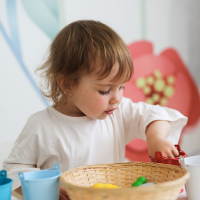 A young child playing a sorting game